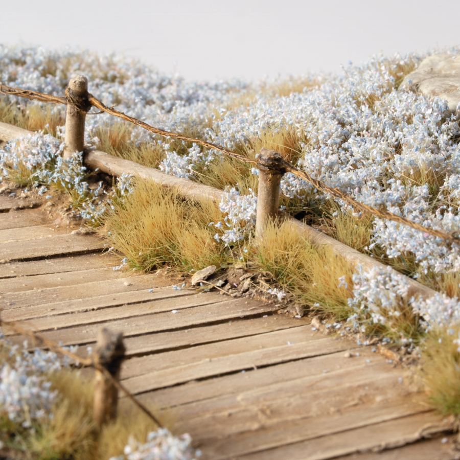 Gamers Grass Flower Tufts - Light Blue Lilac Flowers (6mm) used on a miniature scenic base
